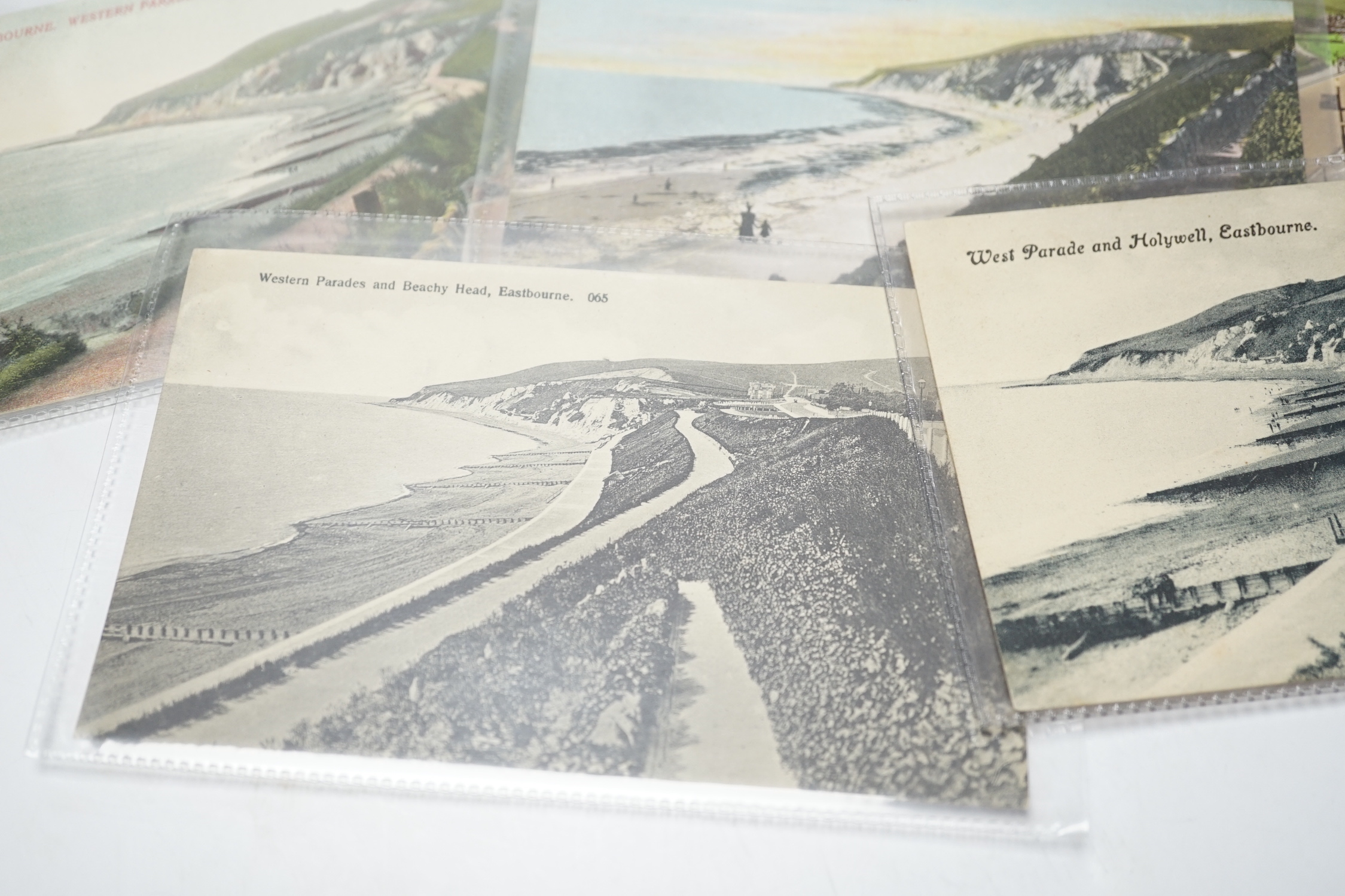 A large quantity of early to mid 20th century postcards of Eastbourne and the surrounding area, all in individual protective sleeves (in two boxes)